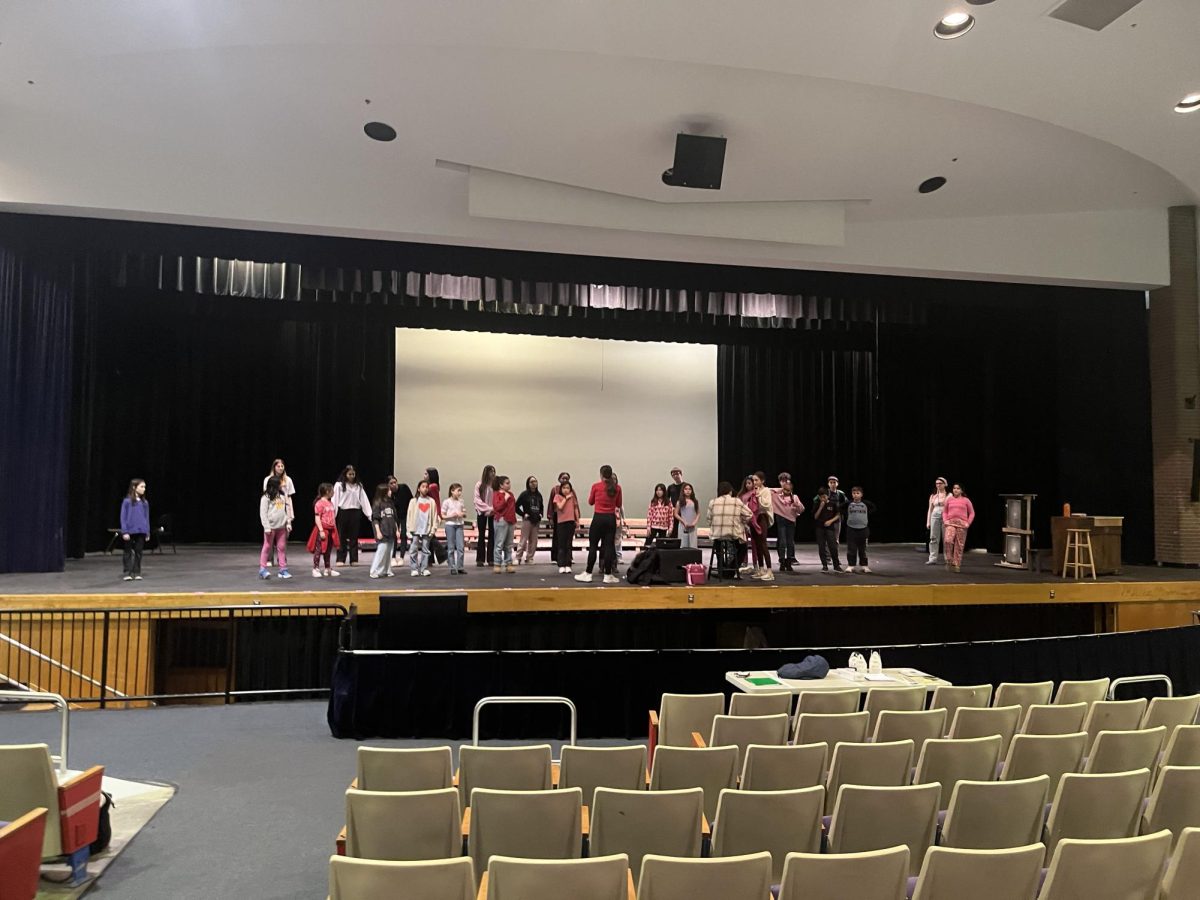 Students practice with the elementary school students on Friday, Feb. 14. "It’s been such an amazing experience especially because they are so cute and they listen and they’re so responsible," junior Trixie Verrija said.