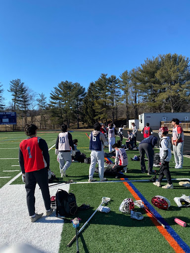 Varsity lacrosse athletes ready for a player-run, off-season workout on Feb. 17. JV and varsity both attended this mixed workout.