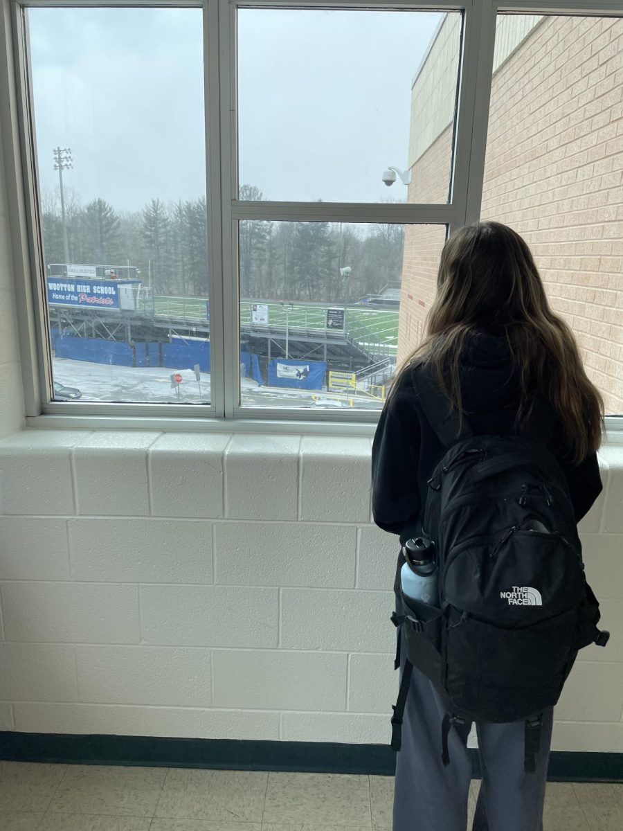 Junior Danielle Rubin looks out the window at the snow in between periods on Thursday, Feb. 20.