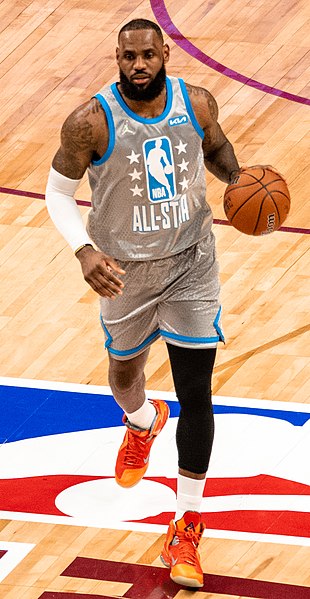 LeBron James dribbles the ball up the court during the All-Star game in 2022 in Cleveland, OH.