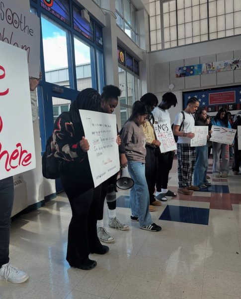 Students protest in the Commons in December, standing against racism and school leadership's response to acts of hate.