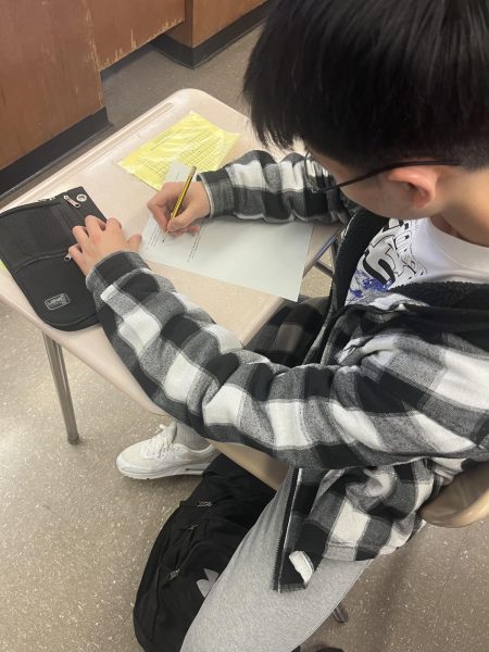 Junior and AP Chemistry student  Kwan Lee works on his chapter 16 review paper in preparation for his upcoming quiz.