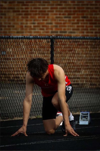 Junior Bryson Filbert lines up on the track for a 100-meter race against Whitman on May 3.