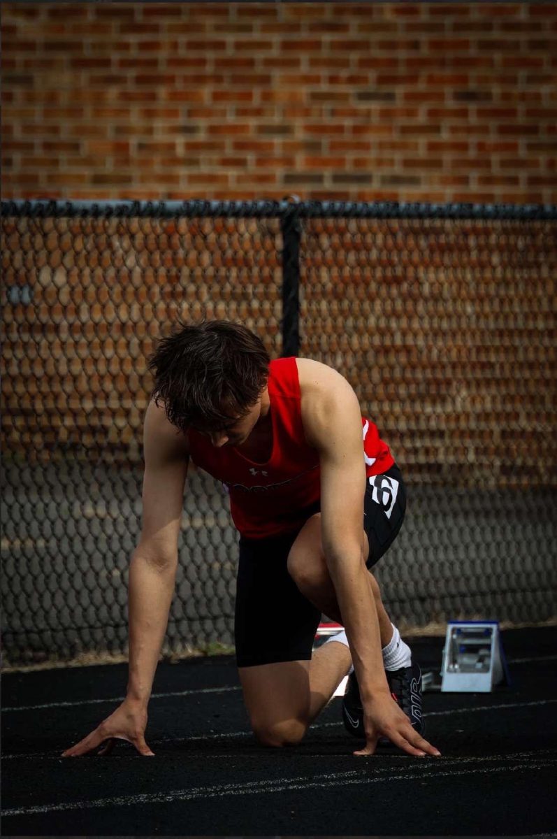 Junior Bryson Filbert lines up on the track for a 100-meter race against Whitman on May 3.