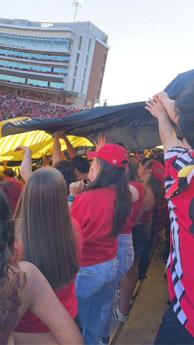 University of Maryland students hold the state flag in a football game against USC on Oct. 19, 2024.
