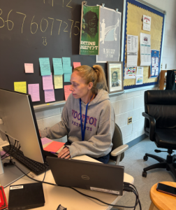English teacher Melissa Kaplan grades assignments in between class periods. Kaplan has been teaching in MCPS for over 15 years, and has had "serious concerns" about the county's grading policy "ever since they got rid of final exams and changed to the trend grading for the semester grade," she said.