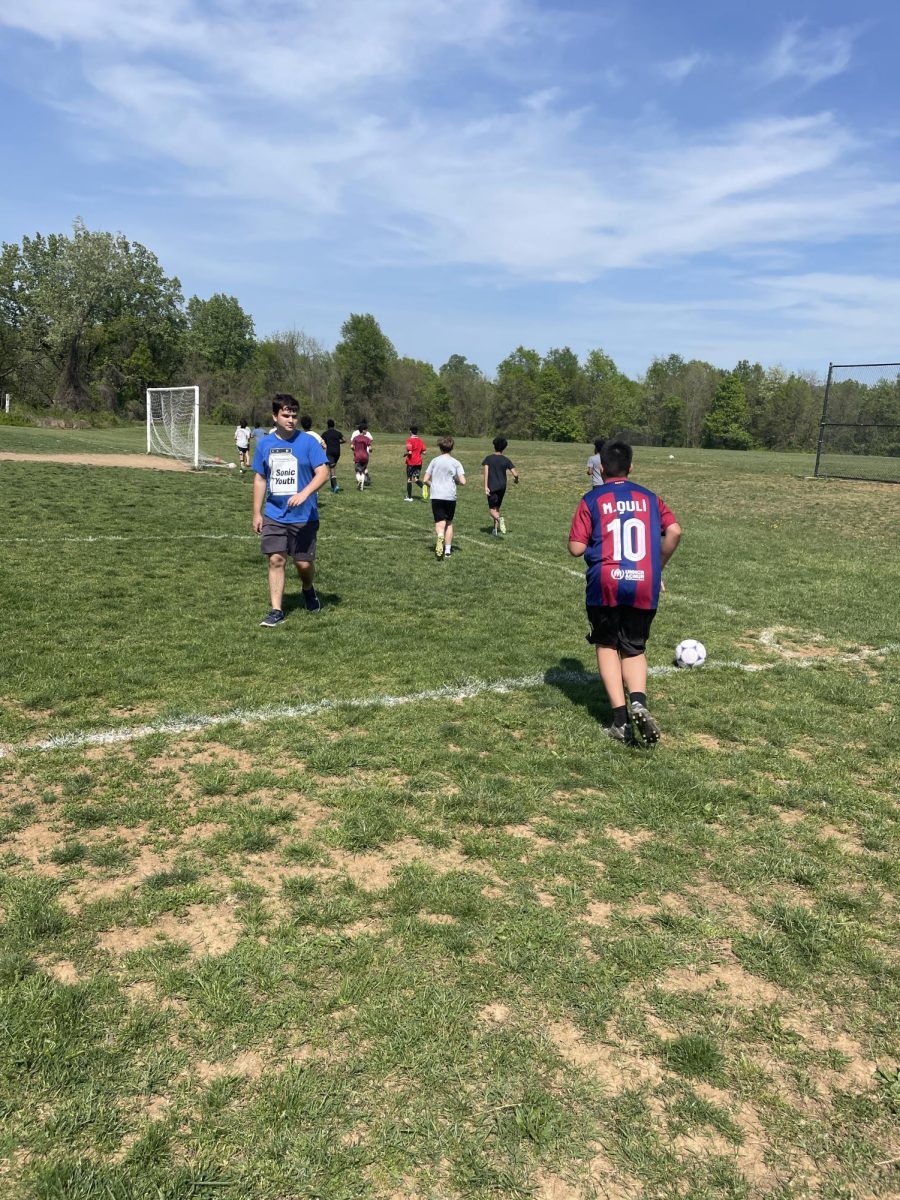 The Frost boys' soccer team takes a warm-up lap around the field before practice on Apr. 30.