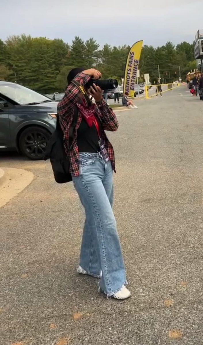 UMD freshman, and Wootton alum Gurnoor Sodhi takes photos before a Patriot football game in 2023.