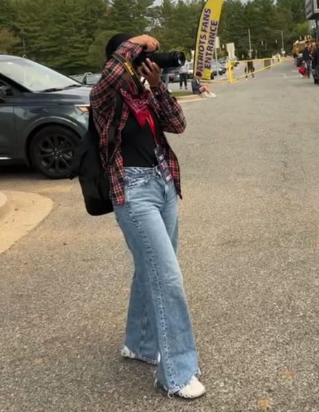 UMD freshman, and Wootton alum Gurnoor Sodhi takes photos before a Patriot football game in 2023.