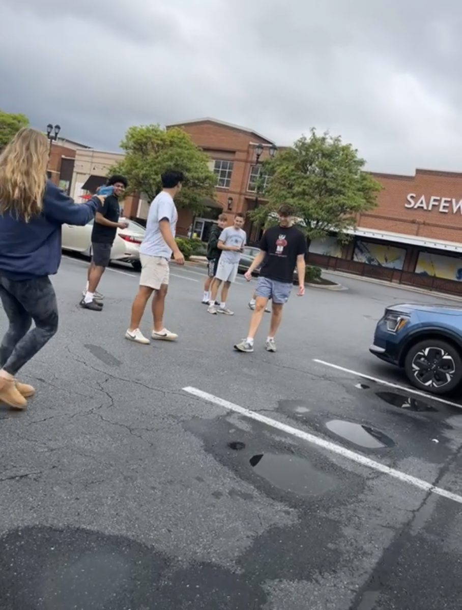 On May 6, a purge day, senior Emily Teague "assassinated" seniors Matthew Xu, Max Greenberg and Miles Sklar in the Fallsgrove parking lot.