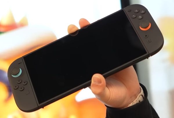 The Nintendo Switch 2 features a sleek black design with magnetically attached Joy-Con 2 controllers. The new controllers have a mouse-like functionality, in which the controllers can be dragged along a surface for an experience reminiscent of using a cursor or moving an in-game camera in a computer game. "For us, the most important thing is that we really want people to recognize and understand that Nintendo Switch 2 is the true successor to Nintendo Switch, takes what you love about Nintendo Switch, and then builds on it with a whole lot of new features and new capabilities and new games that take advantage of those," Nintendo of America Vice President Bill Trinen said in an interview with IGN.