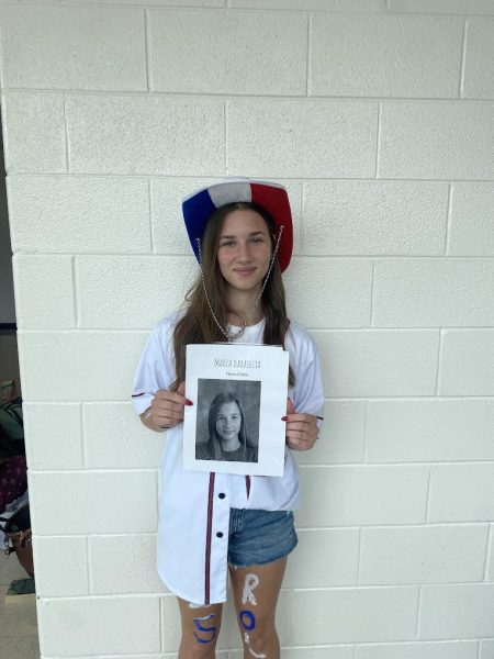 Senior Maria Daraselia (this writer) holds with the poster announcing her first board position for Common Sense.