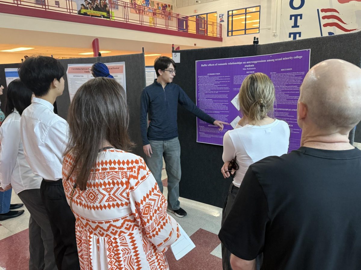 Senior Max Rubinstein presents at the AP Research symposium on Apr. 26. For a year-long, work-intensive class like AP Research, students find it important to stay motivated each quarter.