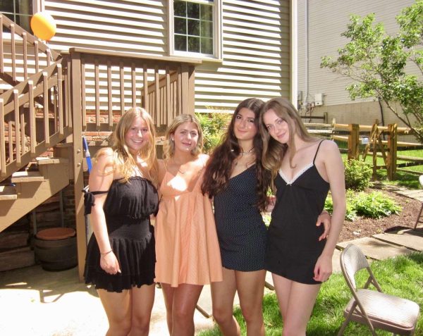 Seniors Emily Teague, Brynn Roemer, Aveen Ghias and Audrey Sherman celebrate at Roemer's graduation party on May 10.