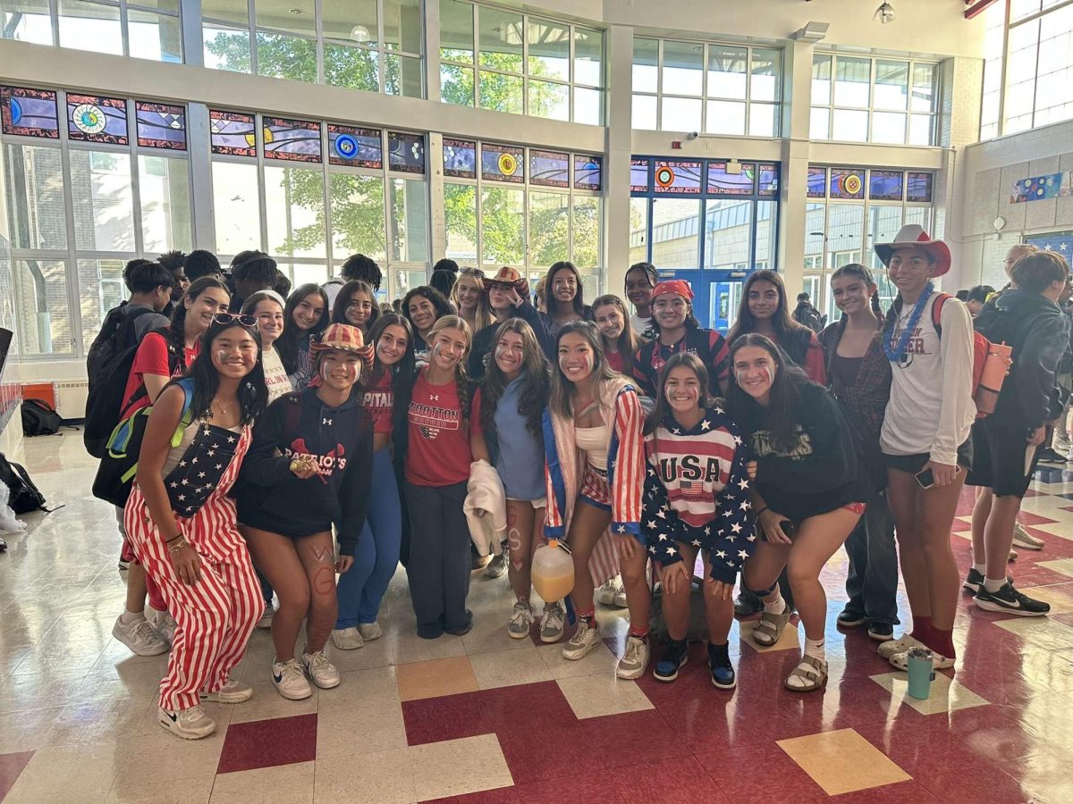 The varsity girls' soccer team wears USA-themed outfits during lunch on Monday, Sept. 8, before their season-opener home game against Century High School. “People should come support [girls' soccer] to support their friends, classmates, and women’s sports. I can also promise an exciting soccer game," senior striker and wing Isy Caban said. Photo courtesy Megan Lomotan