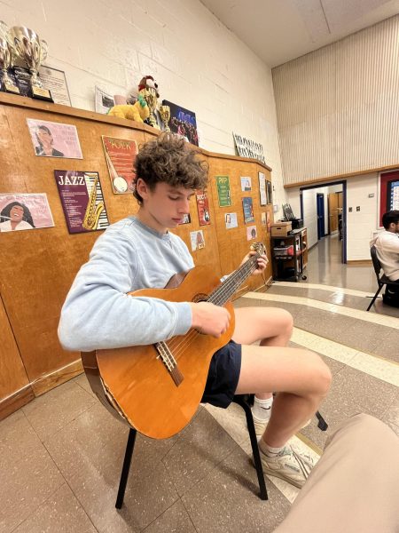 Senior Justin Heller practices his skills in his guitar class. Photo courtesy Justin Heller