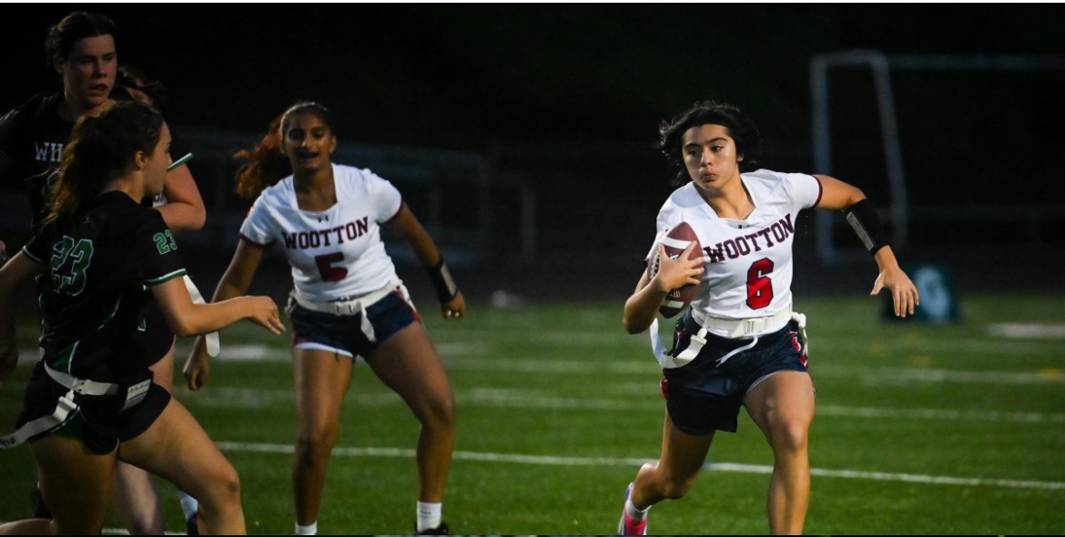 Number 6 senior Gabriella Guidorizzi plays on the girls' varsity flag football team versus Walter Johnson last school year. Guidorizzi was a key player in the success of the team's season despite playing soccer at the same time. "I don’t like that dual sport was removed because I really enjoyed playing flag and I miss playing with my flag teammates," senior Gabriella Guidorizzi said. Photo courtesy Gabriella Guidorizzi