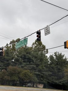 New "no turn on red" signs prohibit drivers from turning onto Fallsgrove Blvd at the intersection next to Medical Center.