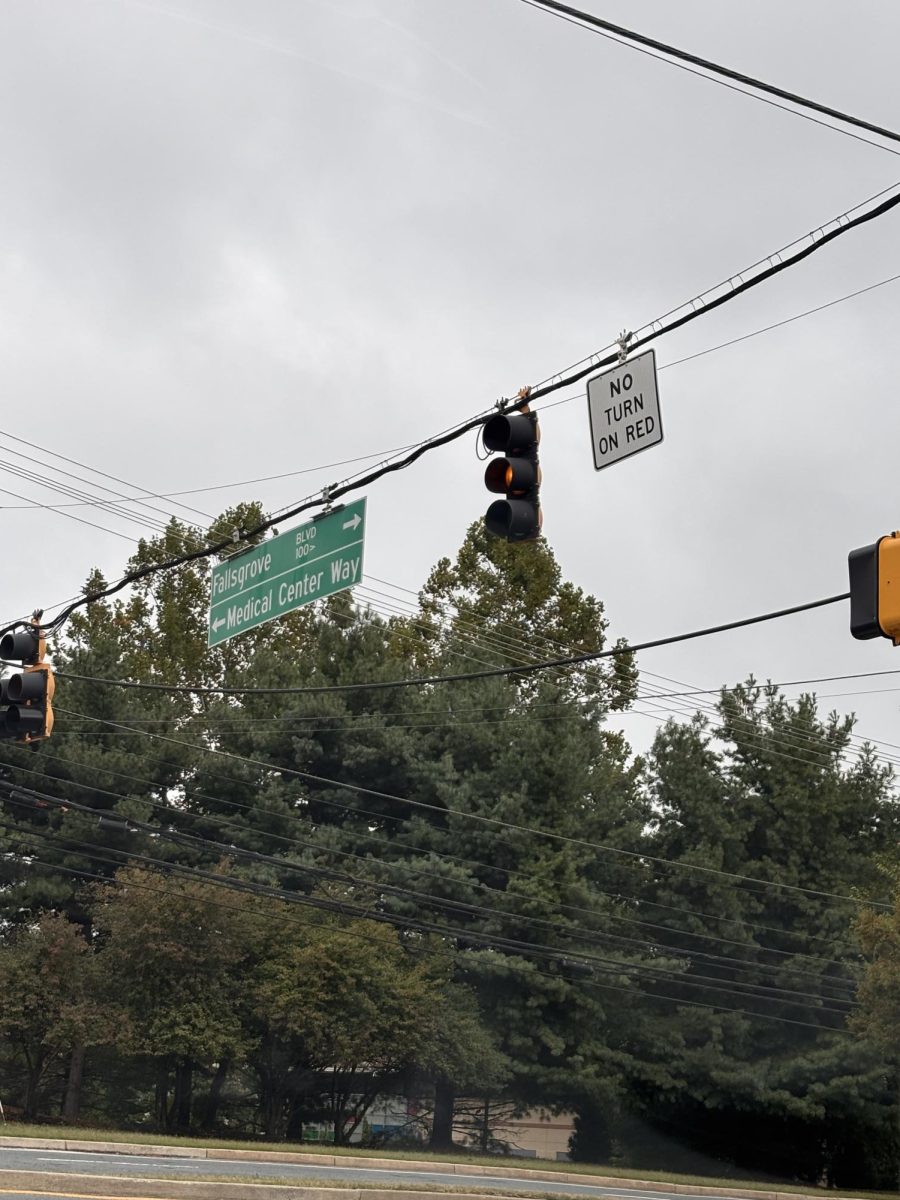 New "no turn on red" signs prohibit drivers from turning onto Fallsgrove Blvd at the intersection next to Medical Center.