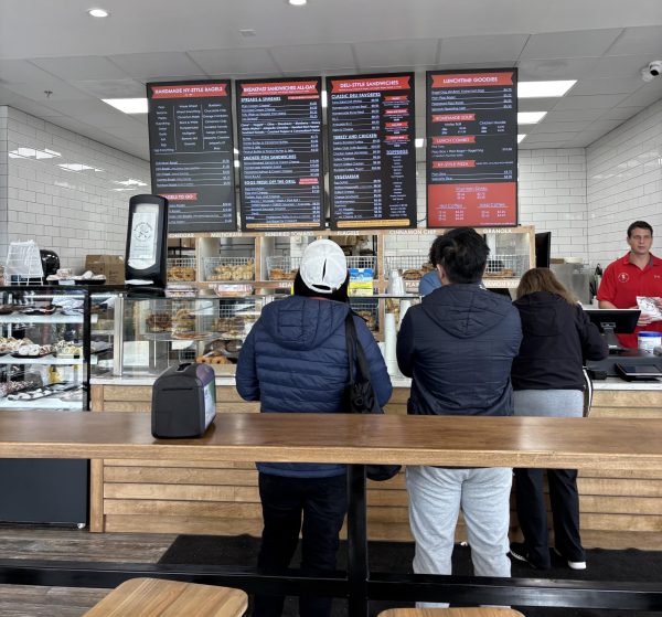 Customers await their bagel orders at Bethesda Bagels in Cabin John Shopping Center.