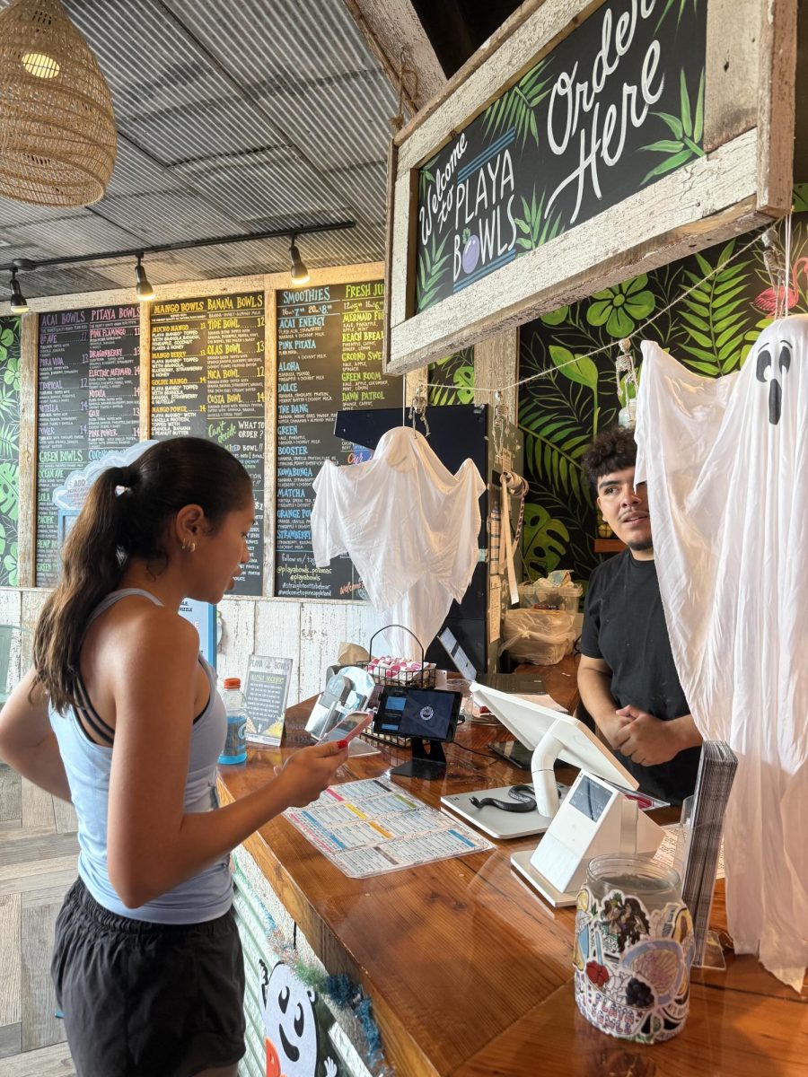 Junior Jia Micalizzi stops at Playa Bowls in Cabin John Village for a acai bowl after participating in a 5k run with her field hockey team.