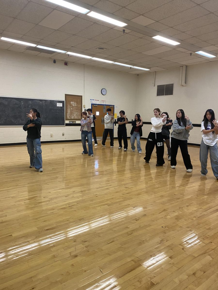 The K-Pop Dance Club practices for their POTH performance during their Oct. 28 meeting in the dance studio.  The club starts by watching the president, senior Jiyoo Min, perform the piece before it is taught step-by-step.
