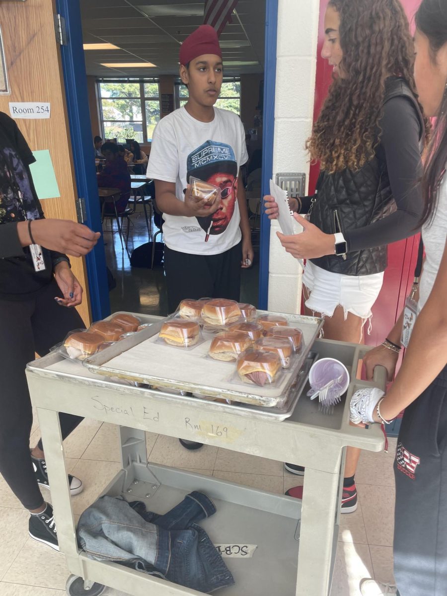 Members of the Student Government Association help distribute lunches to students in their classrooms. Students who needed lunches were able to get a sandwich, but were sent home shortly after. "I wanted to go home and students weren't really given much information because they didn't have internet for their Chromebooks," senior Sedi Gborglah said.