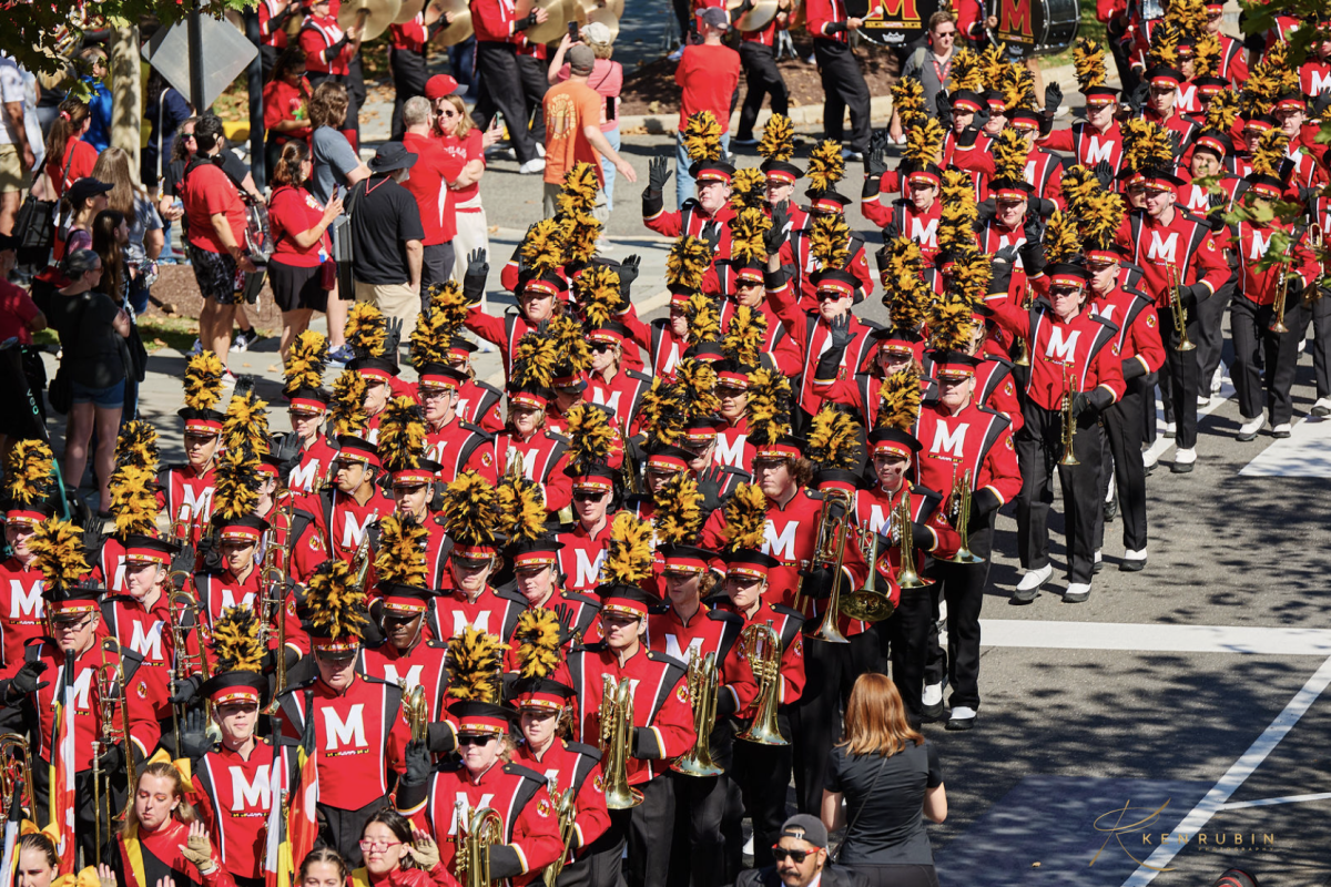 The University of Maryland's "Mighty Sound of Maryland" marches in a parade before their performance on Sept. 13. "One of the things that I love the most about continuing marching band into college is being able to meet people who have the same passion about the activity as me," class of 2024 alum Waverly Nakashima said. Photo by Ken Rubin