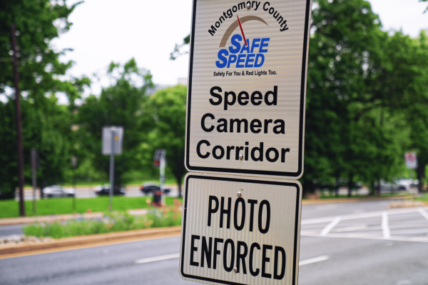 Signage for Montgomery County Safe Speed, Speed Camera Corridor, Photo Enforced on Wisconsin Avenue in Bethesda, Maryland. More of these signs will be installed around the county with the new speeding laws. Photo used with permission from Google Creative Commons, by Tony Webster