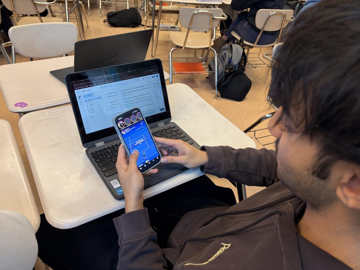 Junior Armaan Chawla scrolls through Instagram during class. 