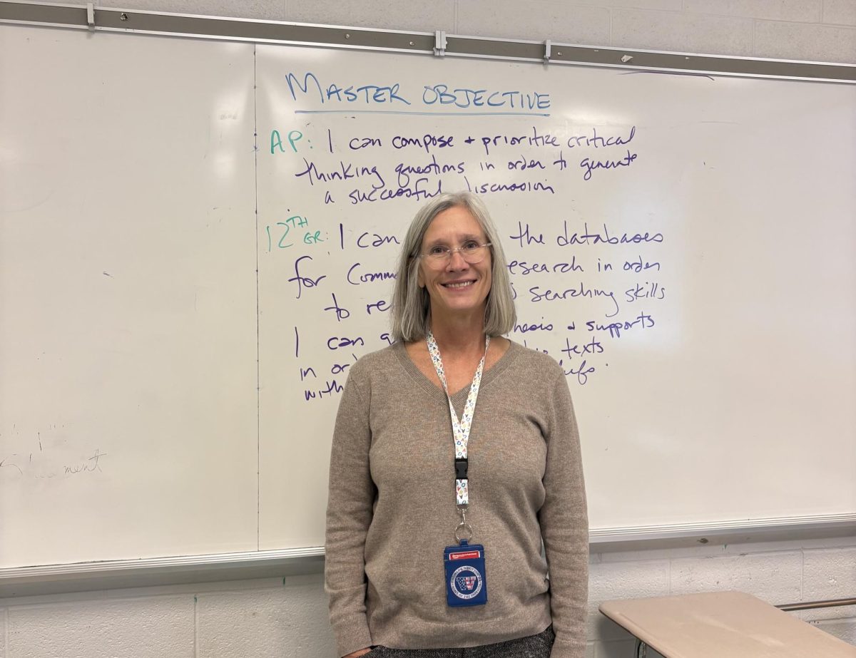 English teacher Annette Evans prepares for her classes with a mastery objective for her AP Lang and Honors 12 students.