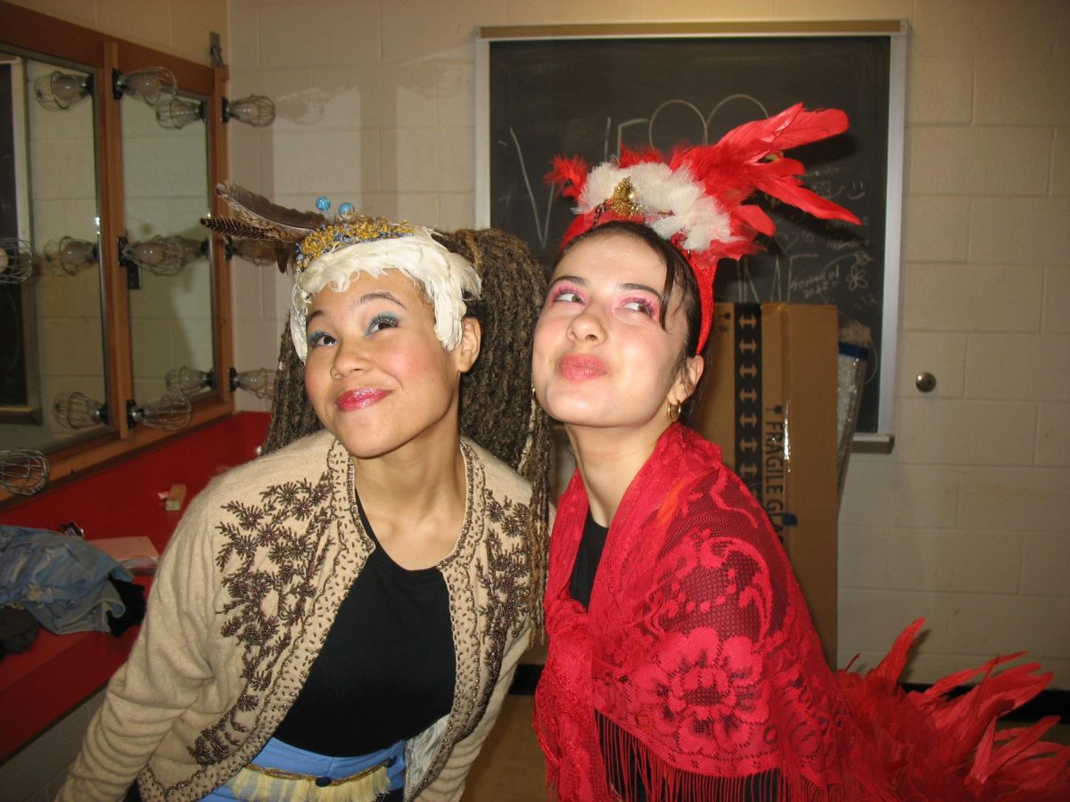 Senior Mona Olson gets into costume and makeup with junior Hazel Goetz behind the scenes of "Seussical." Photo courtesy Mona Olson