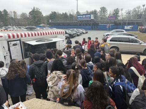 Students swarm the Holy Crepes truck at the start of lunch on Nov. 21 during the first food truck Friday held by SGA.