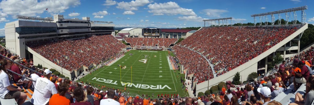 Virginia Tech, along with other major universities, is known for its iconic football tradition of playing a specific song to introduce its team and fire up the crowd. "2016 Lane Stadium Panoramic" by User:B is licensed under CC BY-SA 4.0.