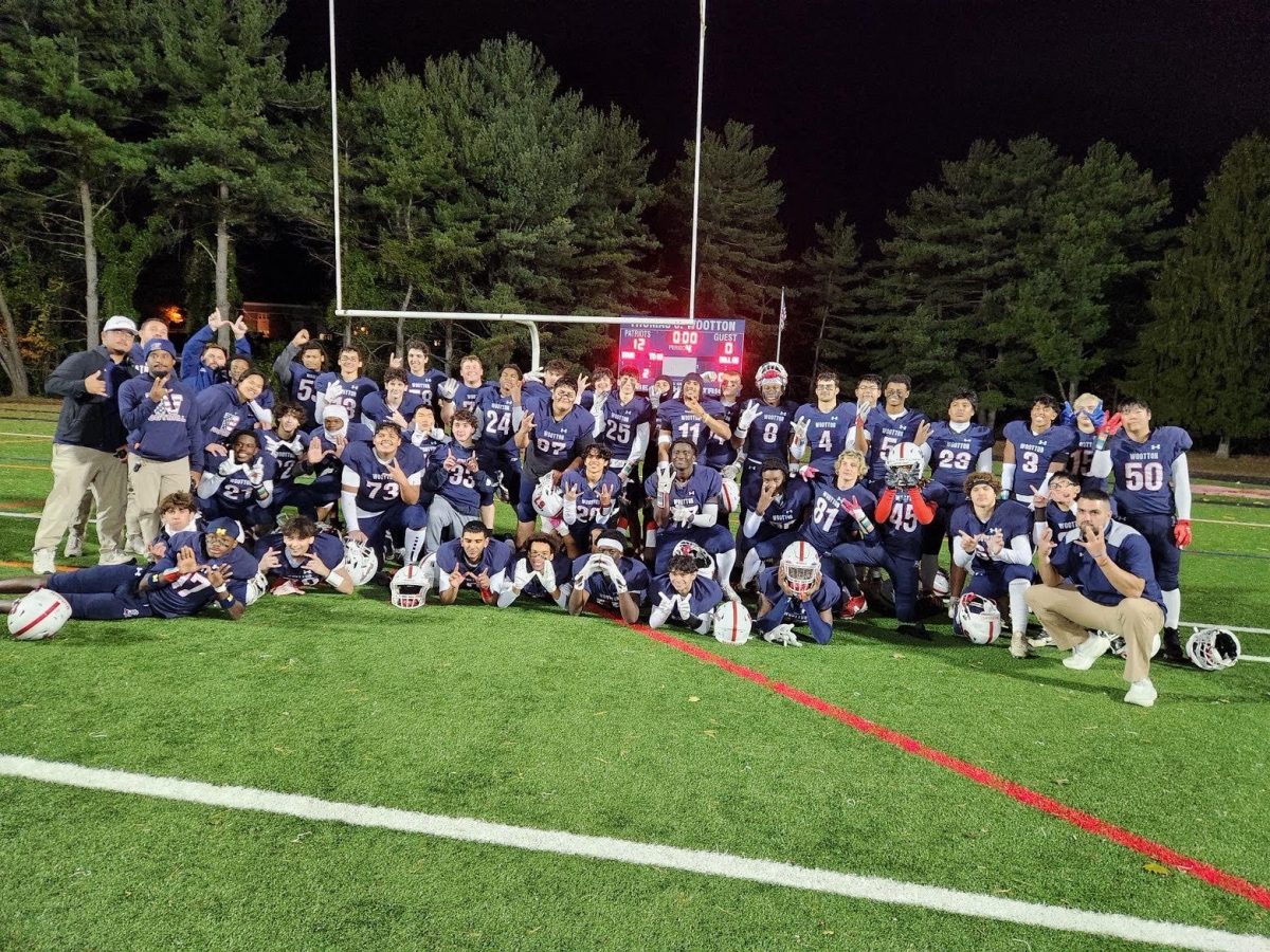 The varsity football team celebrates the Halloween 12-0 shutout victory against Clarksburg in their last regular-season game. "That win ended up being my last ever, so it means a lot to me," senior defensive end Yesh Tafa said. Photo by Jasleen Mishra.