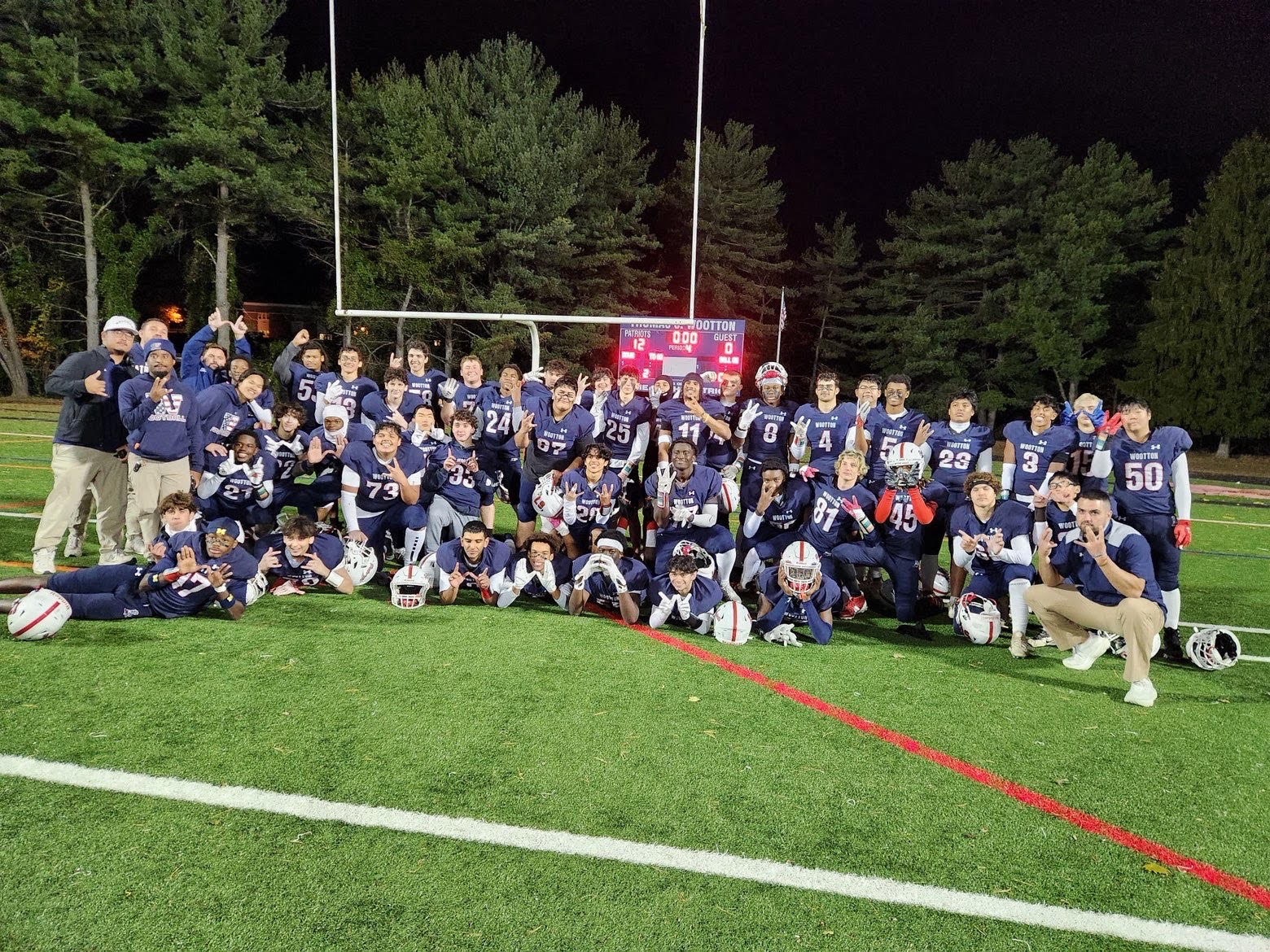 The varsity football team celebrates the Halloween 12-0 shutout victory against Clarksburg in their last regular-season game. "That win ended up being my last ever, so it means a lot to me," senior defensive end Yesh Tafa said. Photo by Jasleen Mishra.