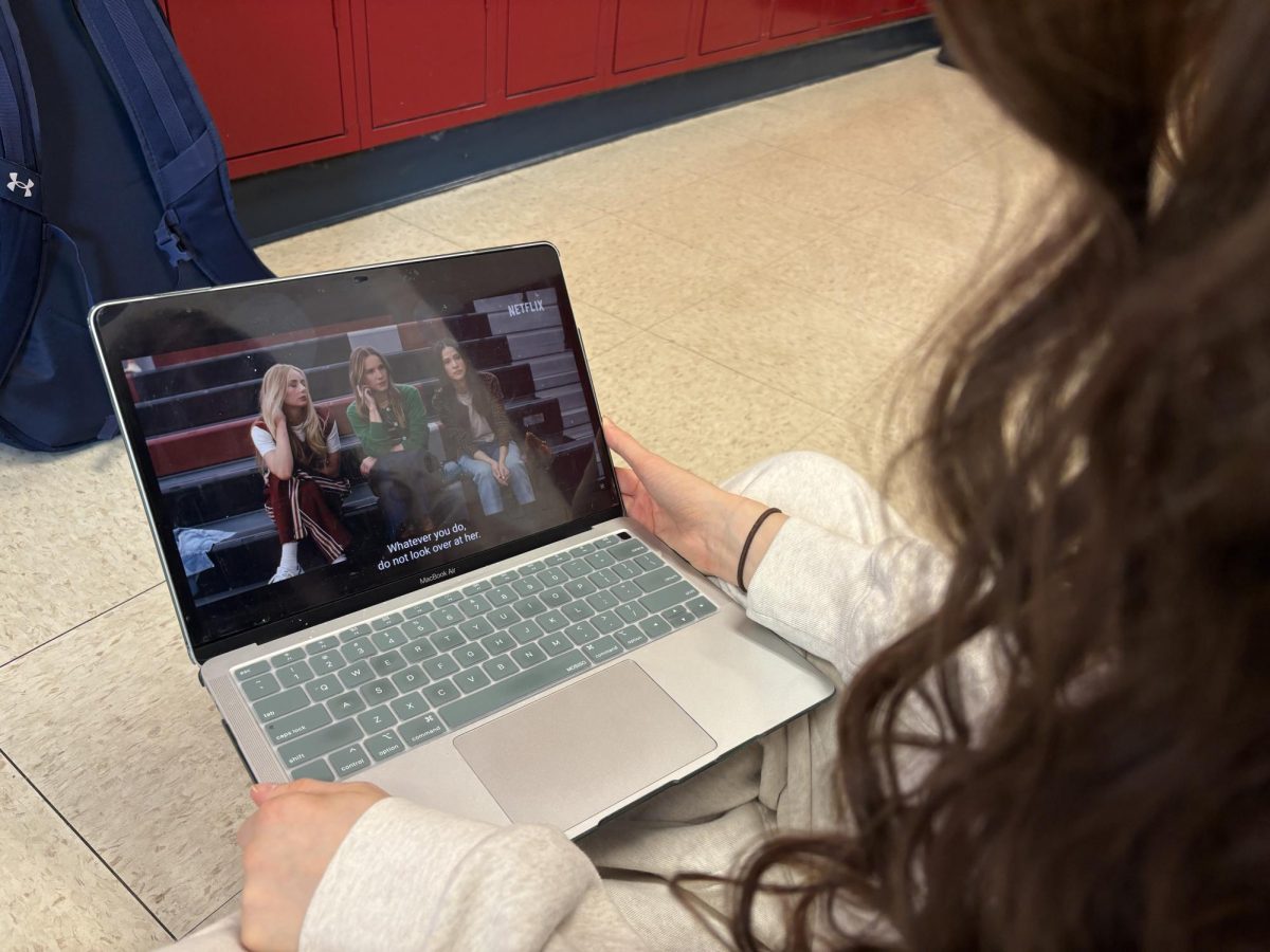 Senior Molly Eisenfeld rewatches the trailer for the second season of "Nobody Wants This," at lunch on Dec. 8. “I really liked it. It seemed bit too similar to the first season in terms of plot line but overall I thought it was so funny,” Eisenfeld said.