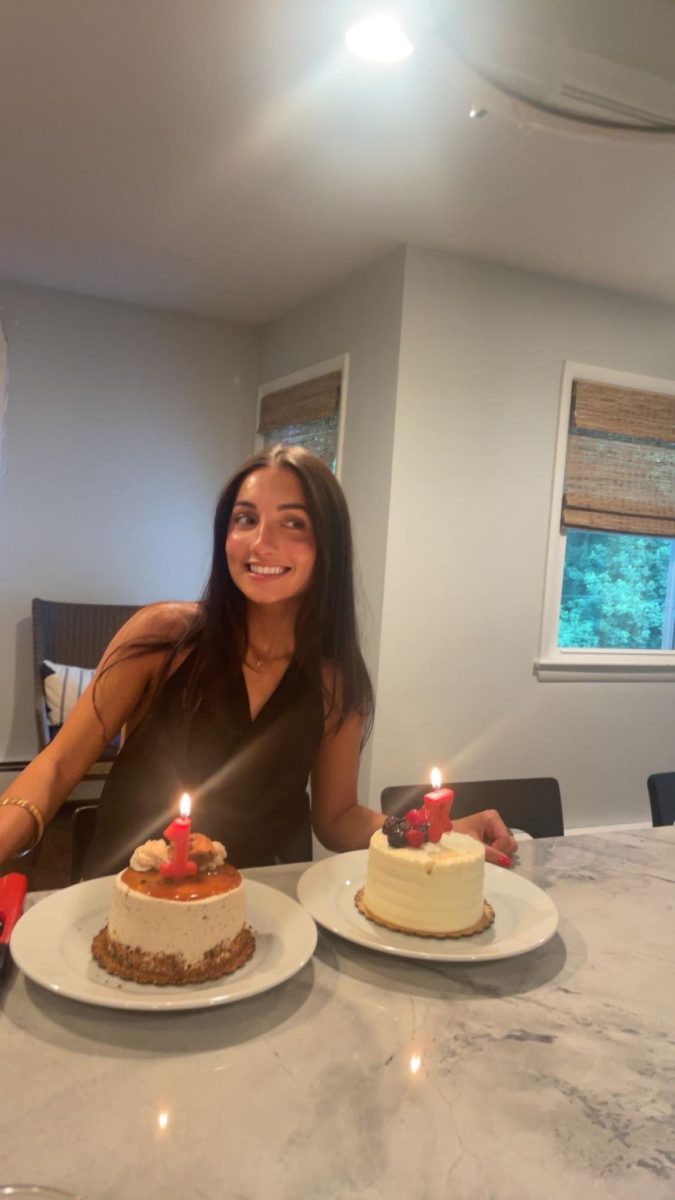 Senior Mia Coven prepares to blow out the candles as she celebrates her birthday with her friends and family. "I like being home to celebrate my birthday and I love eating cake," Coven said.