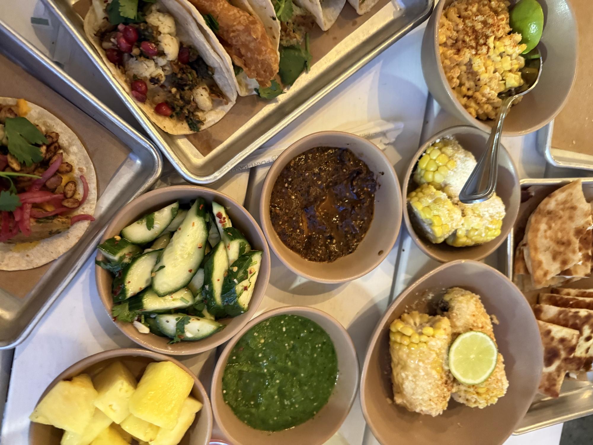 A spread of tacos and sides can be found at Bartaco.