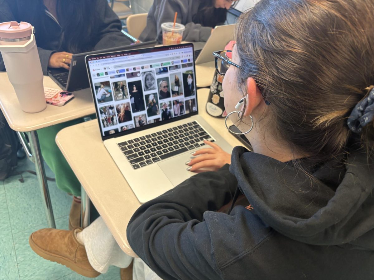 Senior Leila Alam scrolls on Pinterest to add pins of Carolyn Bessette to one of her boards on after watching "Love Story: John F. Kennedy Jr. & Carolyn Bessette Anthology" on March 17. “I loved the cinematography, the music especially, and the way that the actors have so much chemistry. It really brought the story to life for me,” senior Leila Alam said.