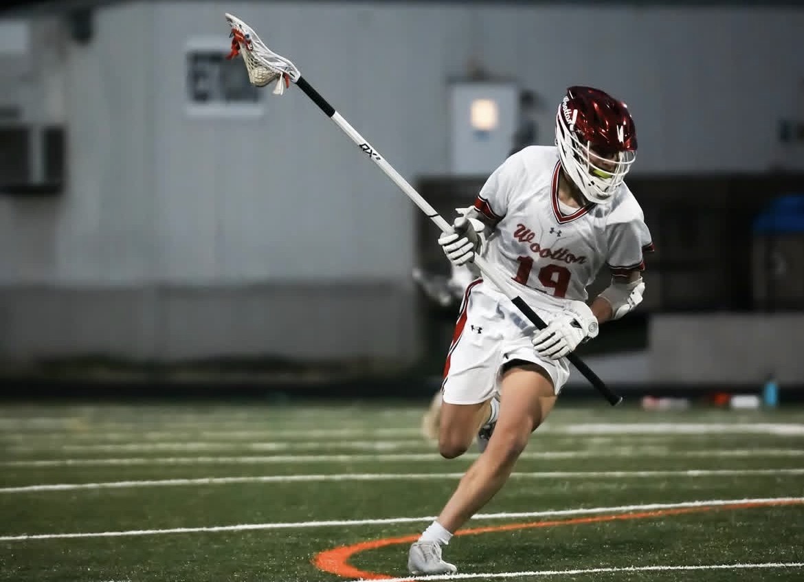Junior Nick Healy plays in the game against Rockville on March 23. The team came out on top 7-6 in a closely fought game. "I think the team is doing really good so far and we have definitely improved from last year, " junior Caleb Cook said. Photo by Liam Snow