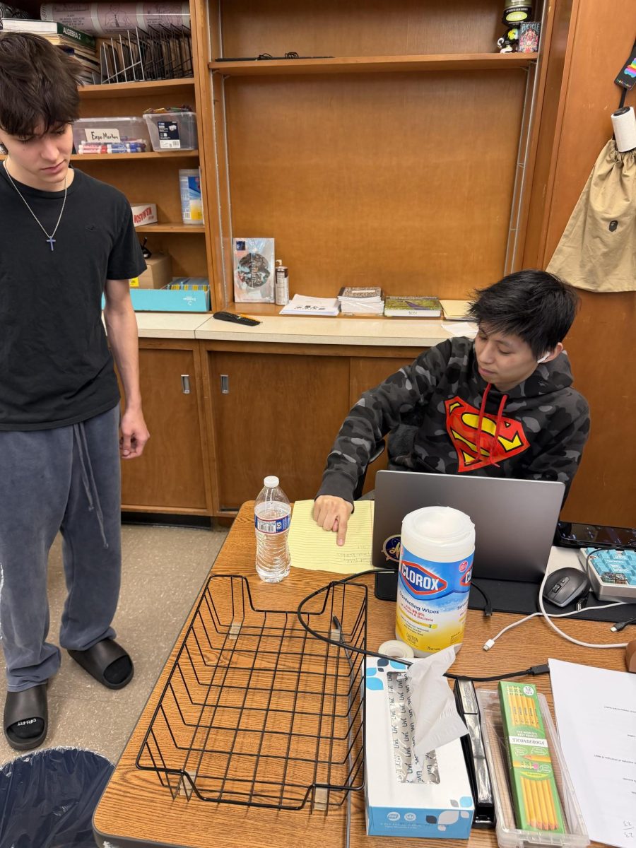 On Feb. 24, during advisory, new math teacher Eddy Yang works one-on-one with sophomore Jack Gray, breaking down practice problems and clarifying concepts ahead of Gray.’s upcoming math quiz.