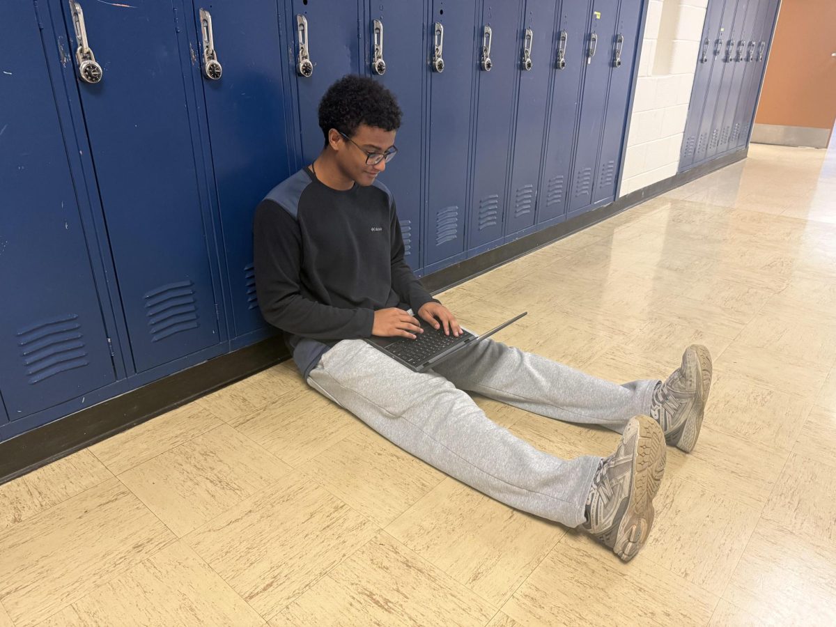 Senior Yesh Tafa does schoolwork during lunch. "I wish I had done more work during lunch in my first few years of high school. It gives me time to complete more work during school, which lets me do things I want to do while at home," Tafa said.