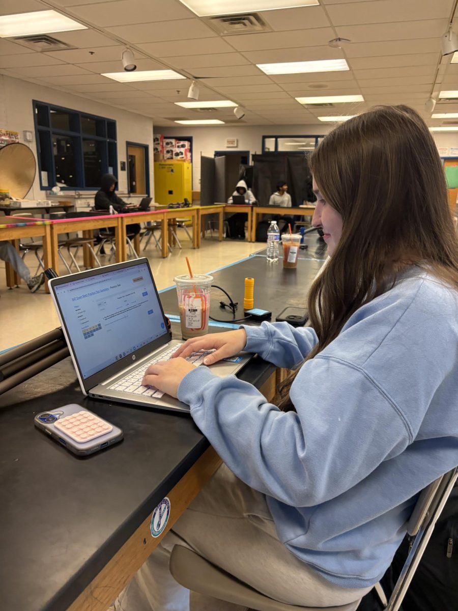 Juniors study for the in-school SAT on Mar. 11. During photography, junior Noa Lucas takes an SAT practice test. "I have been studying for the ACT, so this is my first SAT, and I'm glad I have a chance to take it in a place that I know very well," Lucas said.