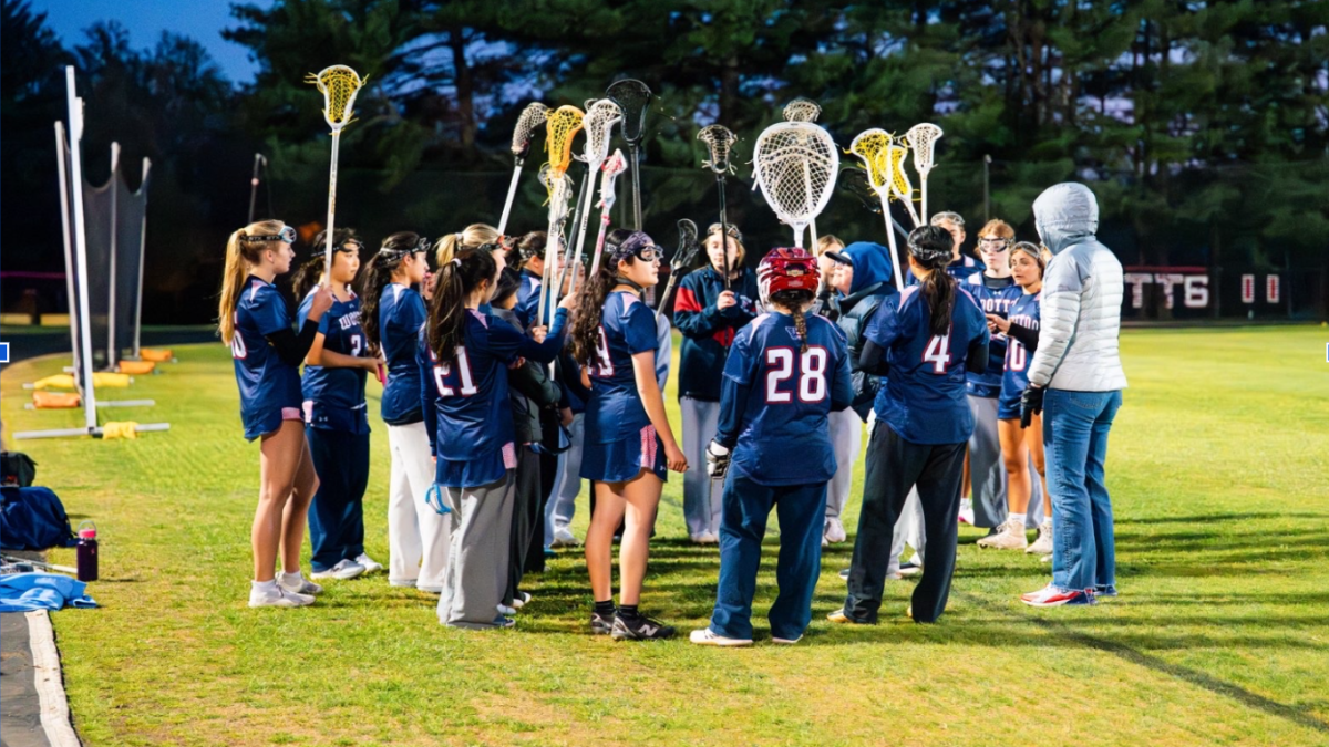 The girls' lacrosse team huddles, discussing the plan before their game against Quince Orchard on April 7. The Patriots fought hard but ended up losing 12-5. This led to the Patriots falling to 2-1 on the year with Walter Johnson up next.