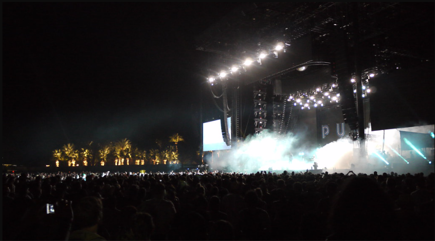 Fans at the Coachella Valley Music and Arts Festival crowd around the stage listening to artists. Sophomore Julia Sullivan said, "Coachella looked super fun and I'm glad Justin Bieber performed." "Coachella" by mild_swearwords is licensed under CC BY-SA 2.0.