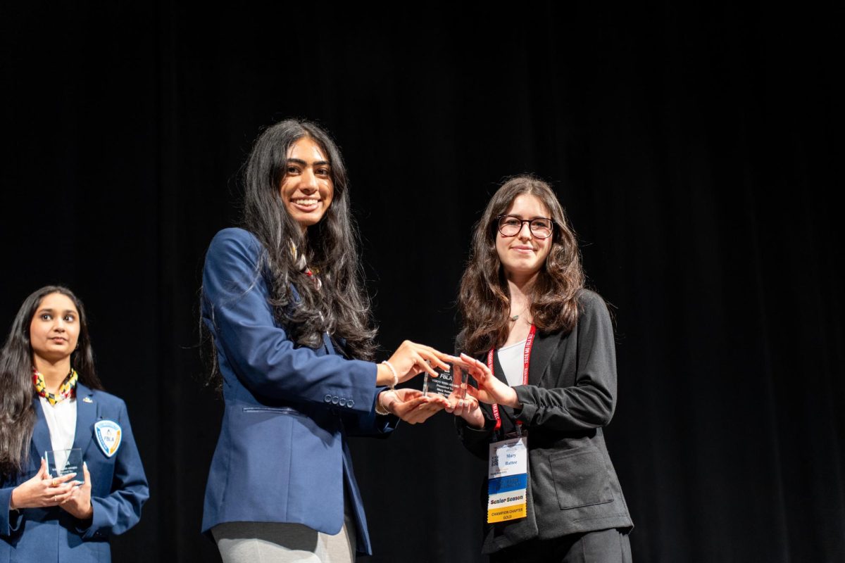 Maryland FBLA State Officer Laya Kudaravalli presents senior Mary Battee as a nominee for the prestigious Who's Who in Maryland FBLA award at the State Leadership Conference. The winner of this award would have the opportunity to represent Maryland at FBLA's national conference. 