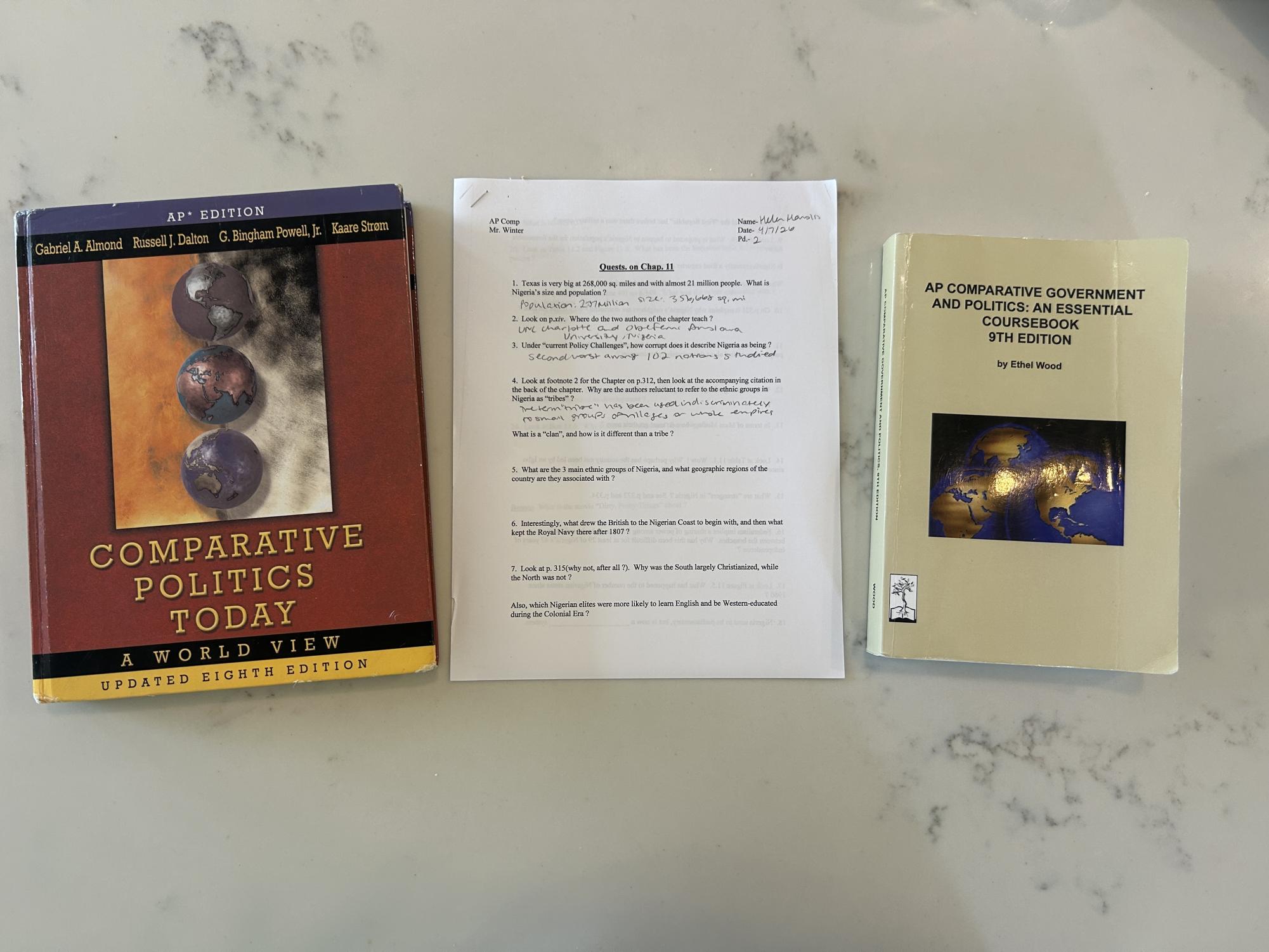 Senior Helen Manolis (this writer) uses her AP Comparative Government textbooks to fill out a quest. These assignments are usually started toward the end of class and assigned as homework if not finished, but they are always completed alone or with a partner.