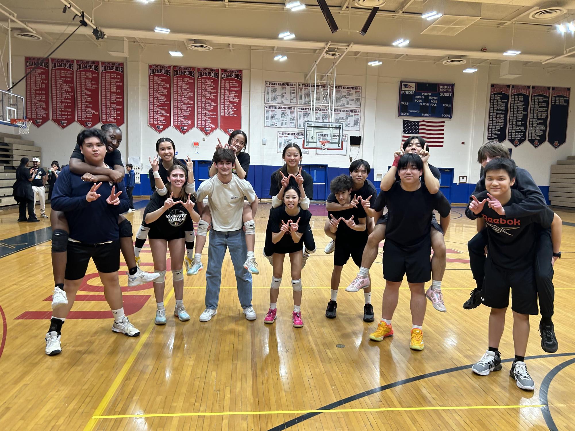 The volleyball team hypes themselves up before winning against Richard Montgomery 4-0 on March 10. During the game, freshman Felipe Machado saved the team from being scored on, which led to the 4-0 win. Photo by Yen Wang.