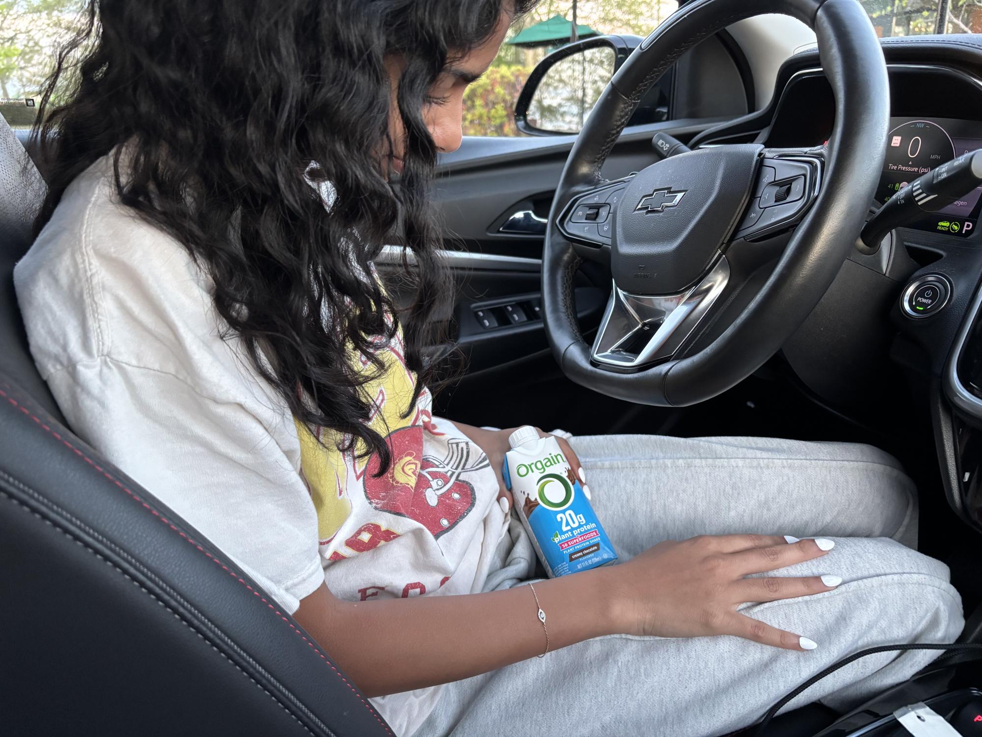 Senior Diya Khetan drinks an Orgain protein shake before school. This drink is ideal for her because she wants a convenient high-protein breakfast to start her day and she doesn't have to waste time by sitting down and eating it at home.